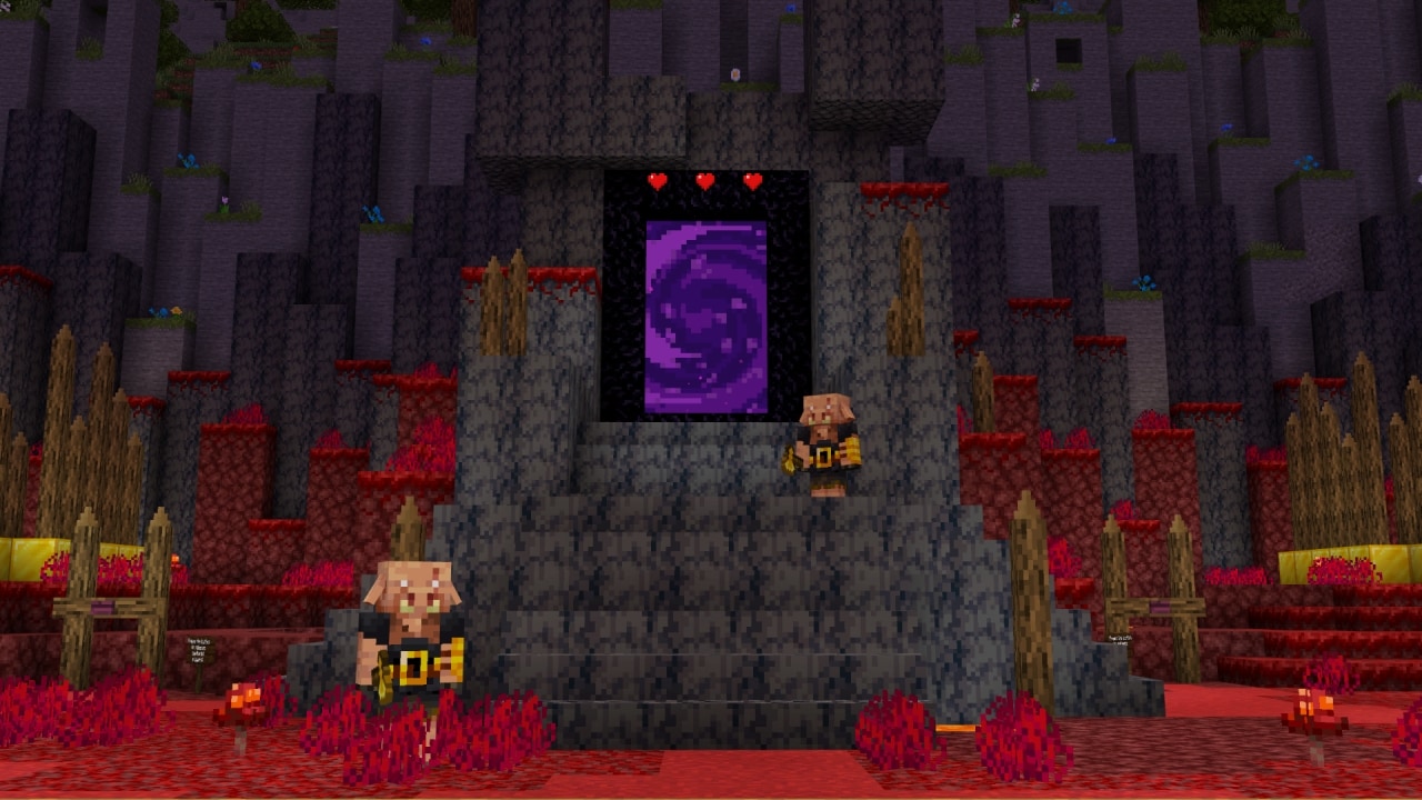 A Nether portal with two piglins standing in front of it.